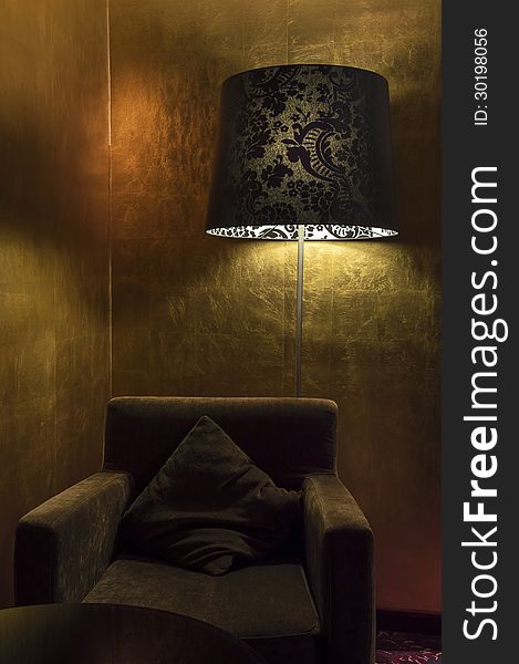 Elegant Armchair and Lamp in Golden Room. Elegant Armchair and Lamp in Golden Room