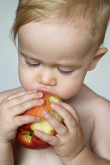 Toddler Eating Apple Stock Photos