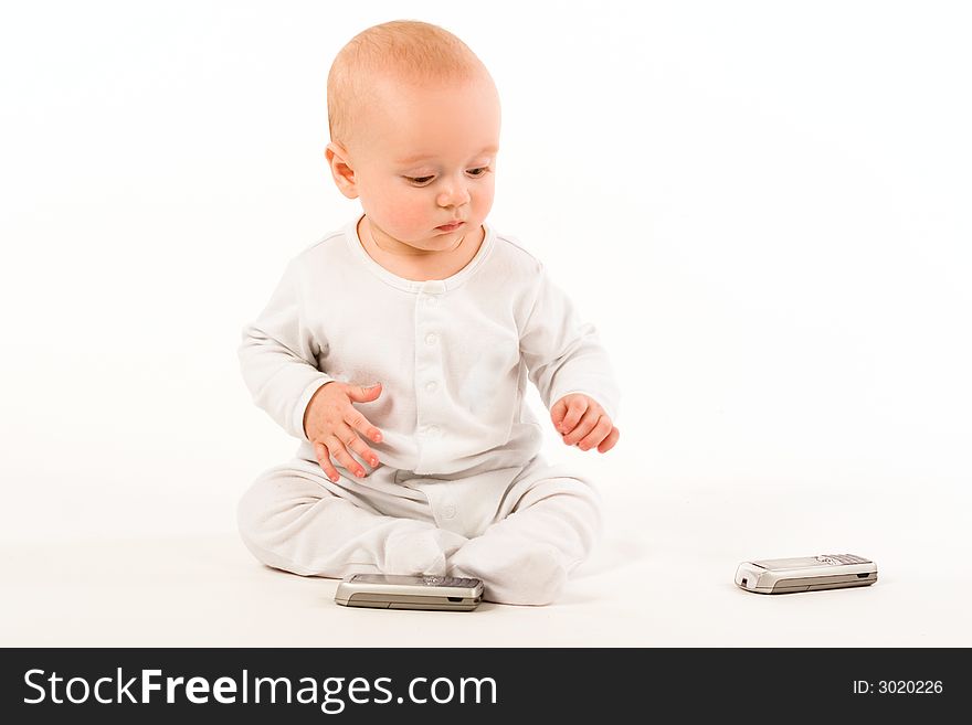 Child chooses between two same phones. Child chooses between two same phones