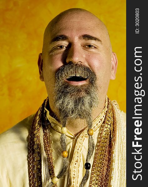 Funny bald guru with a long beaded beard. Funny bald guru with a long beaded beard.