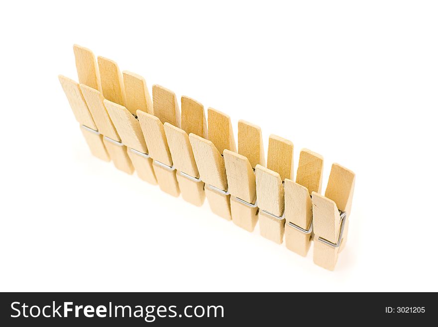 Block of wooden clothespins in a line. Block of wooden clothespins in a line