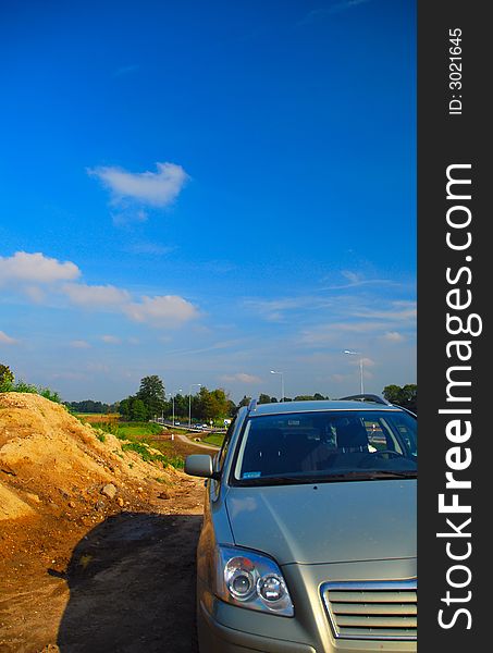 Car on countryside with blue sky scenery. Car on countryside with blue sky scenery