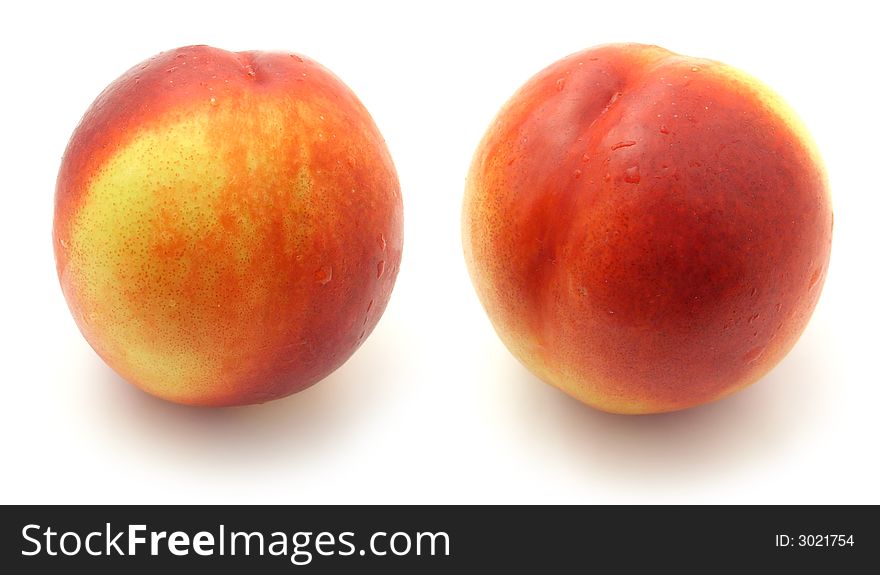 One nectarine. two views. isolated on white.