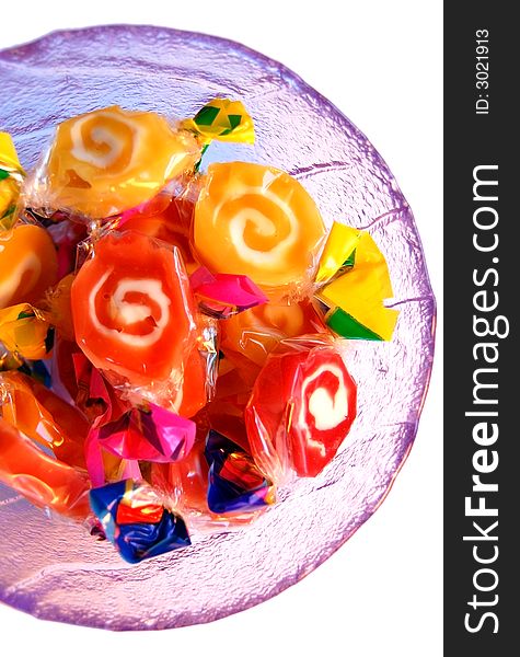 Glass plate full of colorful sweets. Glass plate full of colorful sweets