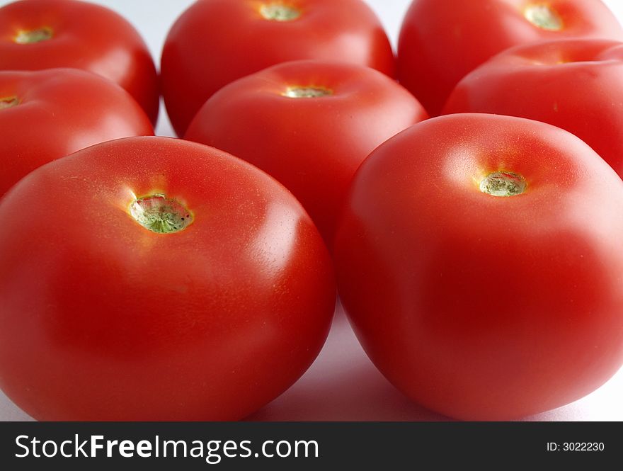 Fresh red ripe tomatoes on white background. Fresh red ripe tomatoes on white background