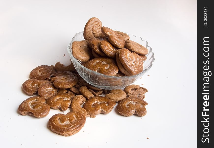 Chocolate cookies in a plate on white background. Chocolate cookies in a plate on white background