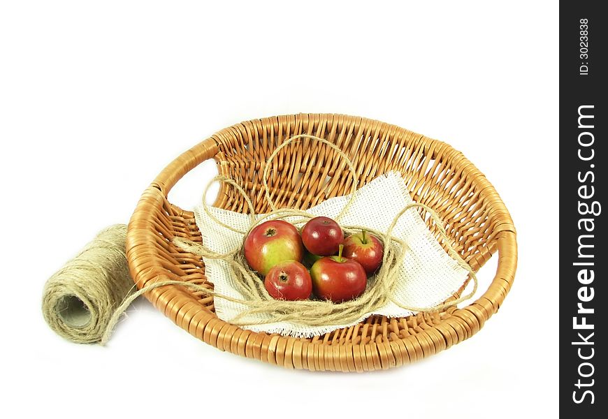 Red apple in basket and string