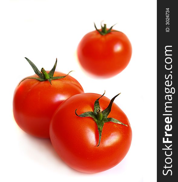 Tomatoes isolated on a white background. Tomatoes isolated on a white background