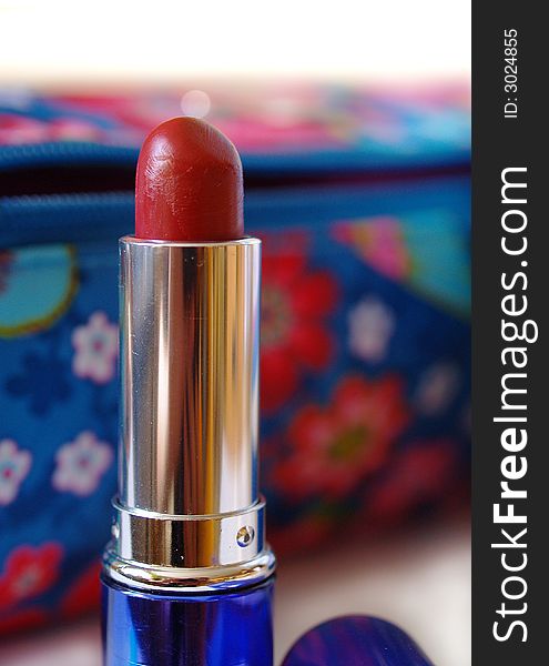 Lipstick on color beautician background