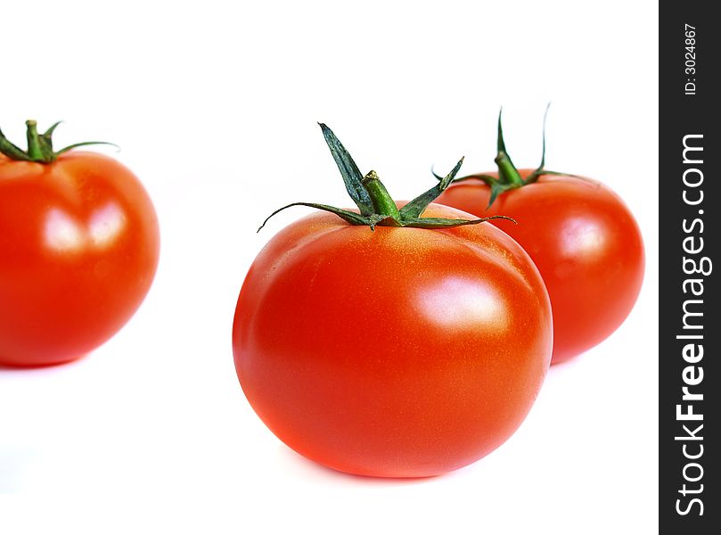 Tomatoes on a white background. Tomatoes on a white background