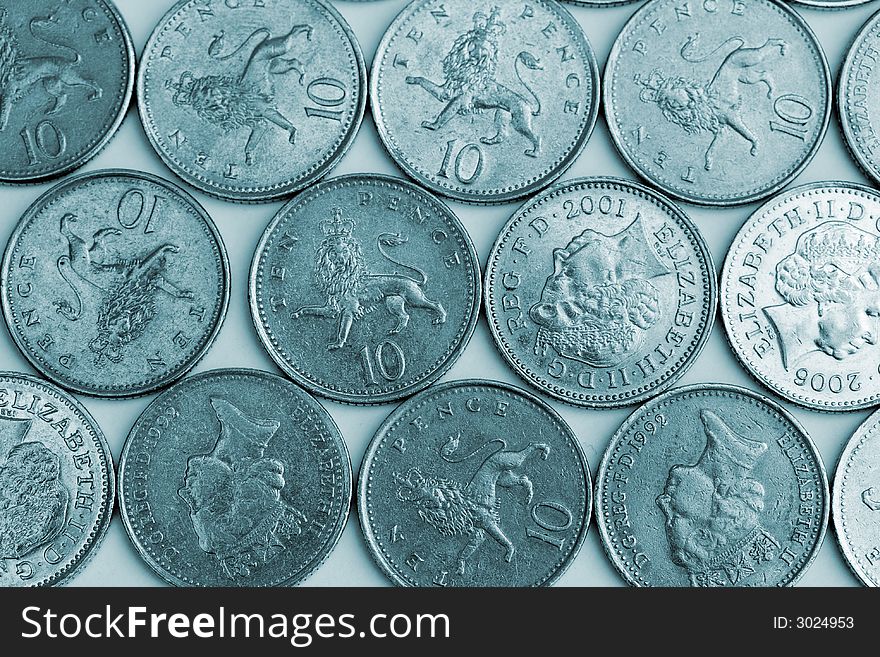 Silver ten pence pieces in a pattern