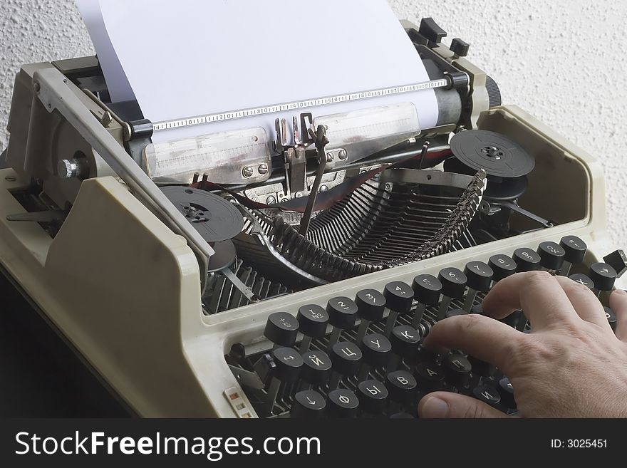 A vintage typewriter with the Cyrillic keyboard