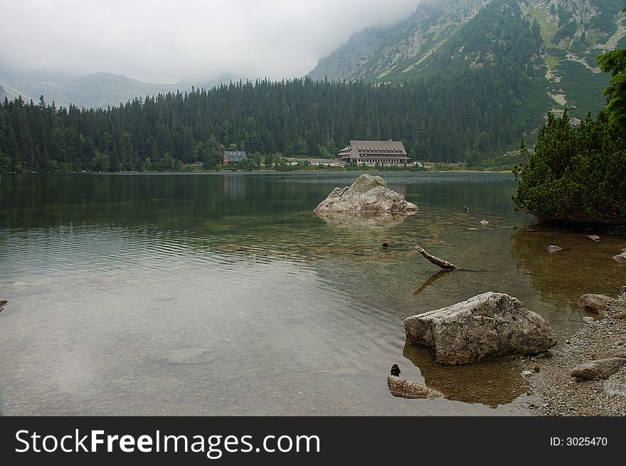 Popradske Pleso is nice lake in High Tatra - Slovakia. Thi photo was created in strong overcast. Popradske Pleso is nice lake in High Tatra - Slovakia. Thi photo was created in strong overcast.