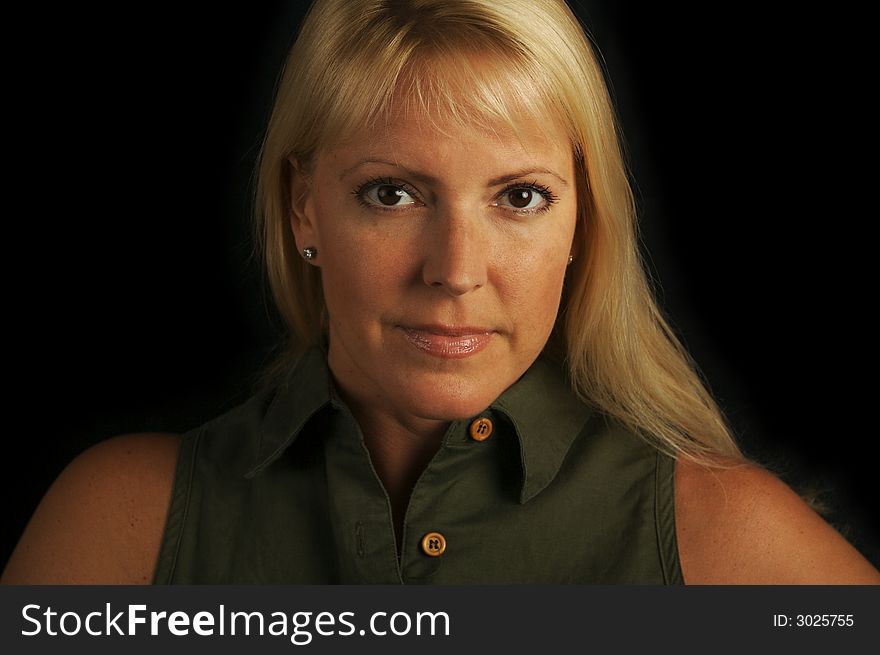 Attractive Blond Haired, Brown Eyed Woman on a Black Background. Attractive Blond Haired, Brown Eyed Woman on a Black Background.