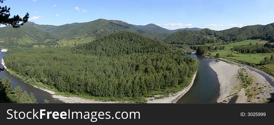 You can see a beautiful view from high rock on turning of fast cold and very clear river which is flowing across green mountains.