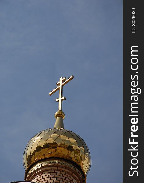 Russian golden church cupola with blue sky like background. Russian golden church cupola with blue sky like background