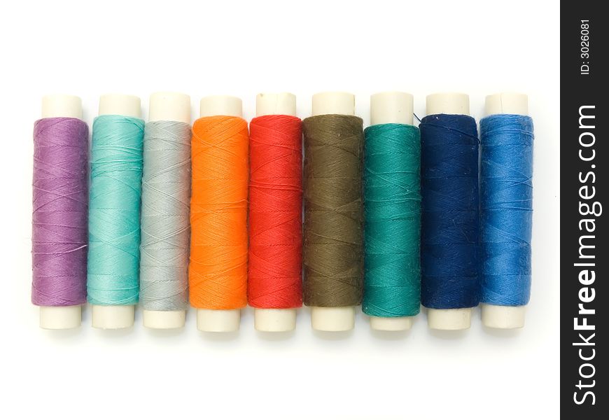 An isolated photo of several colourful threads