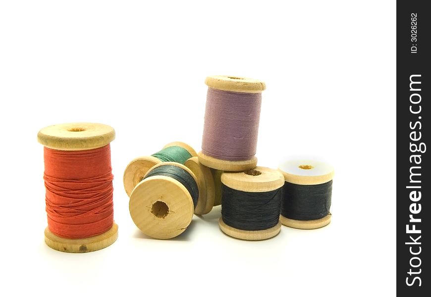 An isolated photo of several colourful threads