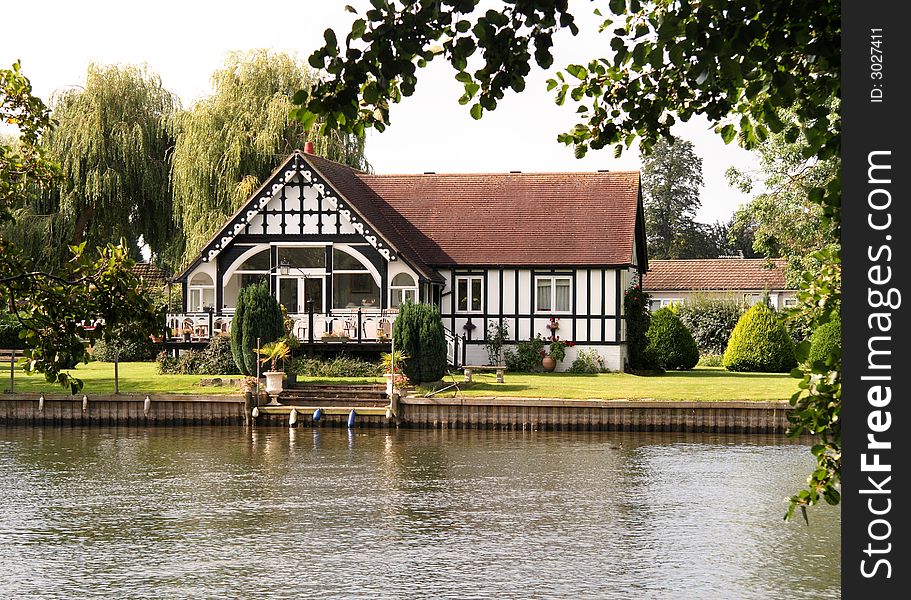 Timber Framed Riverside House and garden on the Banks of the River Thames in England. Timber Framed Riverside House and garden on the Banks of the River Thames in England