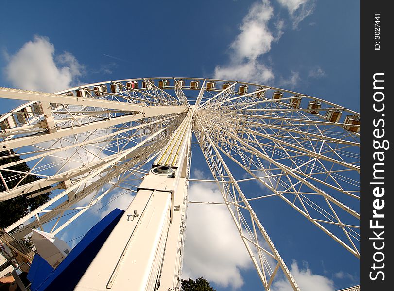 Mobile Ferris Wheel against a deep blue Summer Sky. Mobile Ferris Wheel against a deep blue Summer Sky