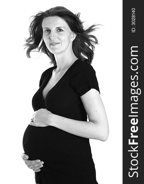 Black and white image of a woman expecting her first child. Black and white image of a woman expecting her first child.
