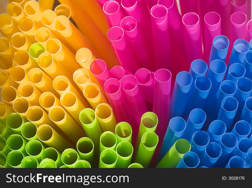 Multi-coloured straws grouped together (viewed from the end - macro).