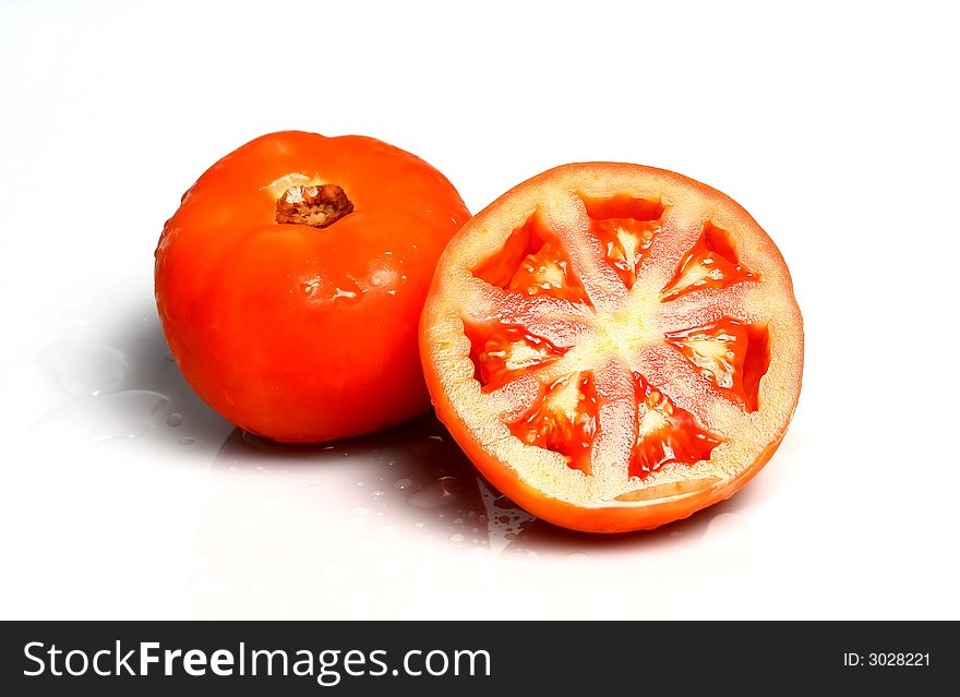 Fresh garden tomatoes on white
