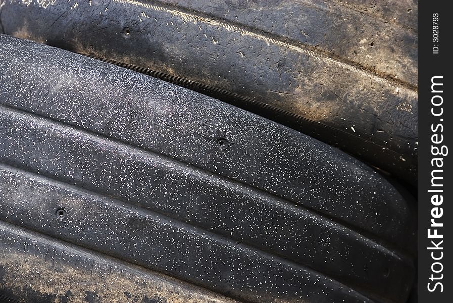 Worn tread on discarded racing tires.
