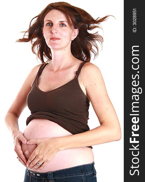 Beautiful woman holding her hands on her belly. Beautiful woman holding her hands on her belly