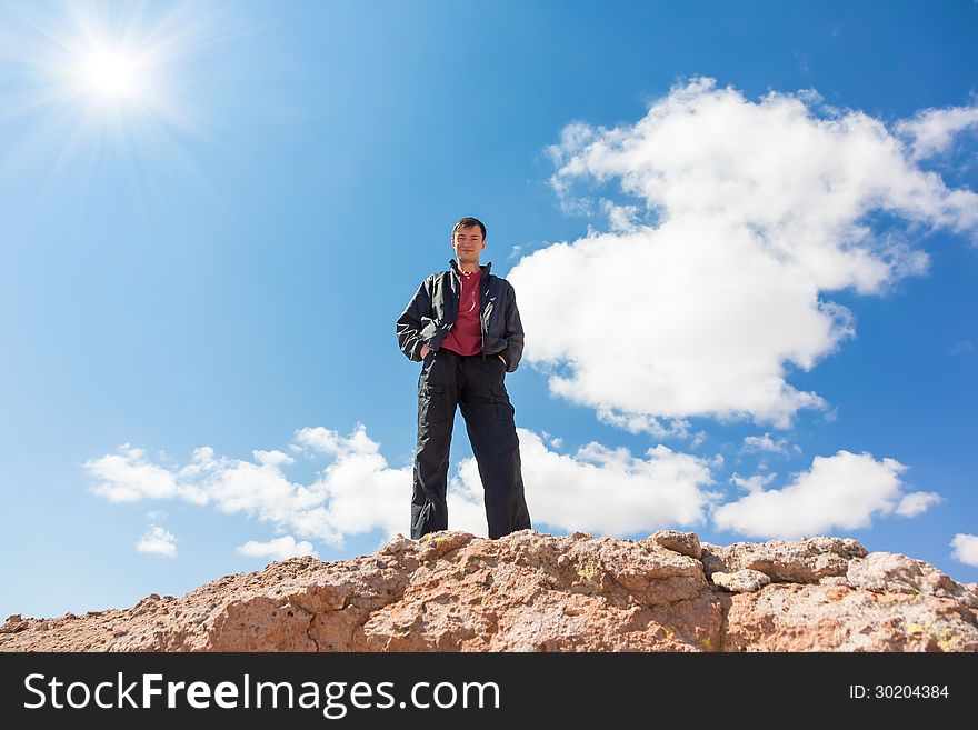 Man Standing On A Rock