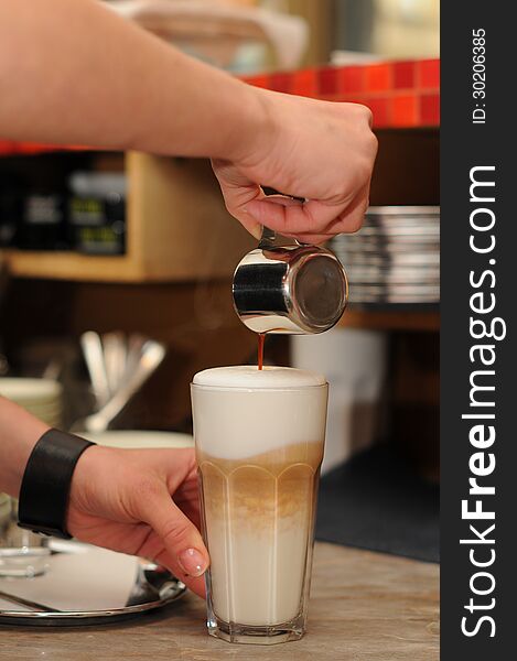 Making of latte macchiato coffee