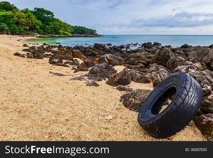 Washed out tyre at beautiful ocean coast in Andaman sea