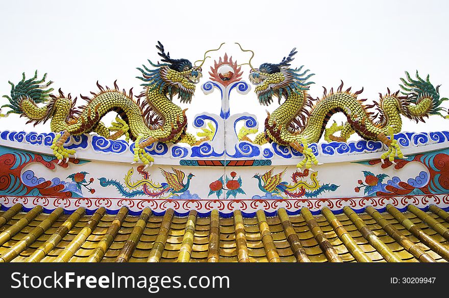 Colorful dragon statue on roof of temple