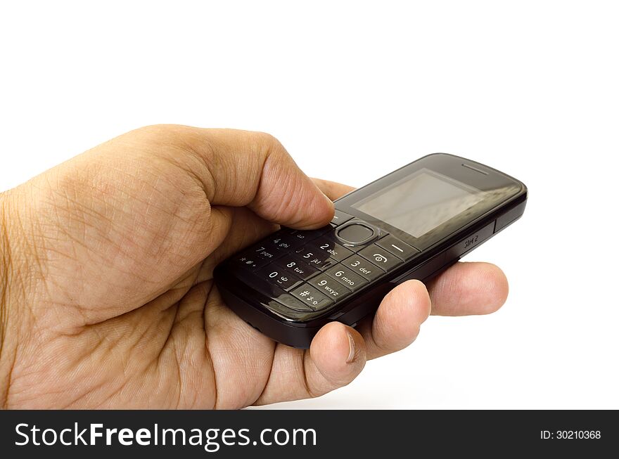 Cell phone in hand against white background.