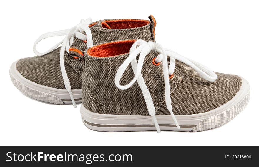Baby's canvas shoes on white background
