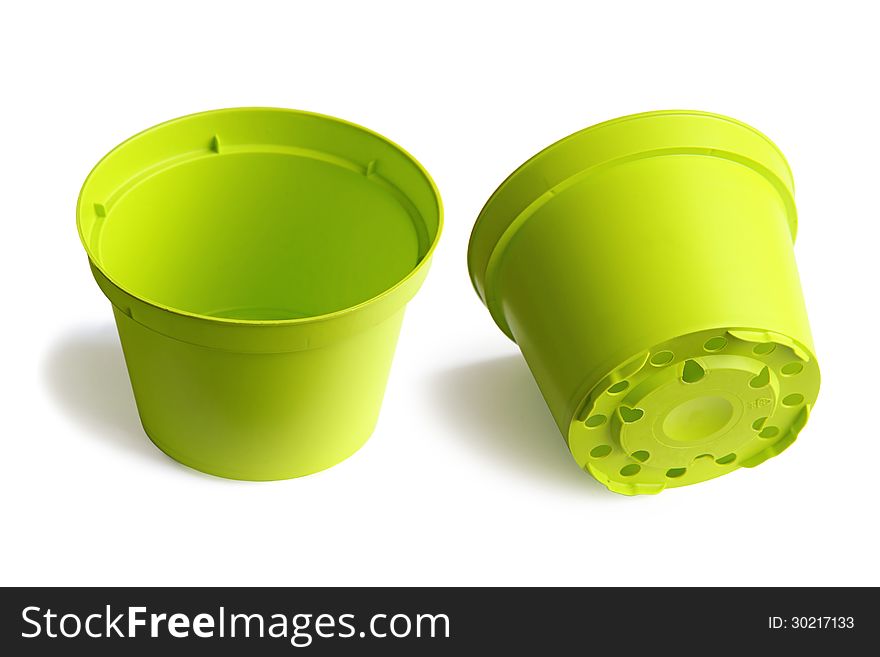 Two plastic plant pots isolated on a white background