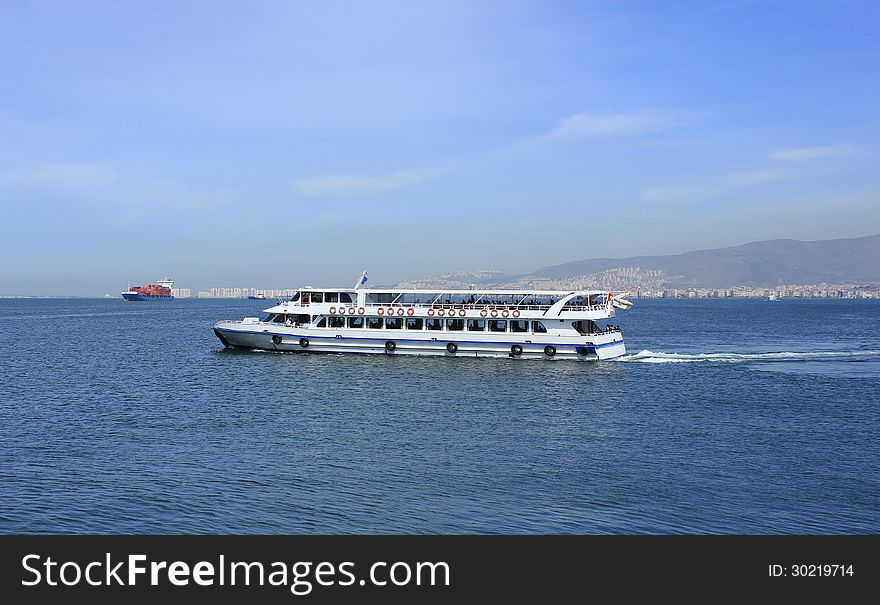 Passenger ship on Izmir bay on Izmir background