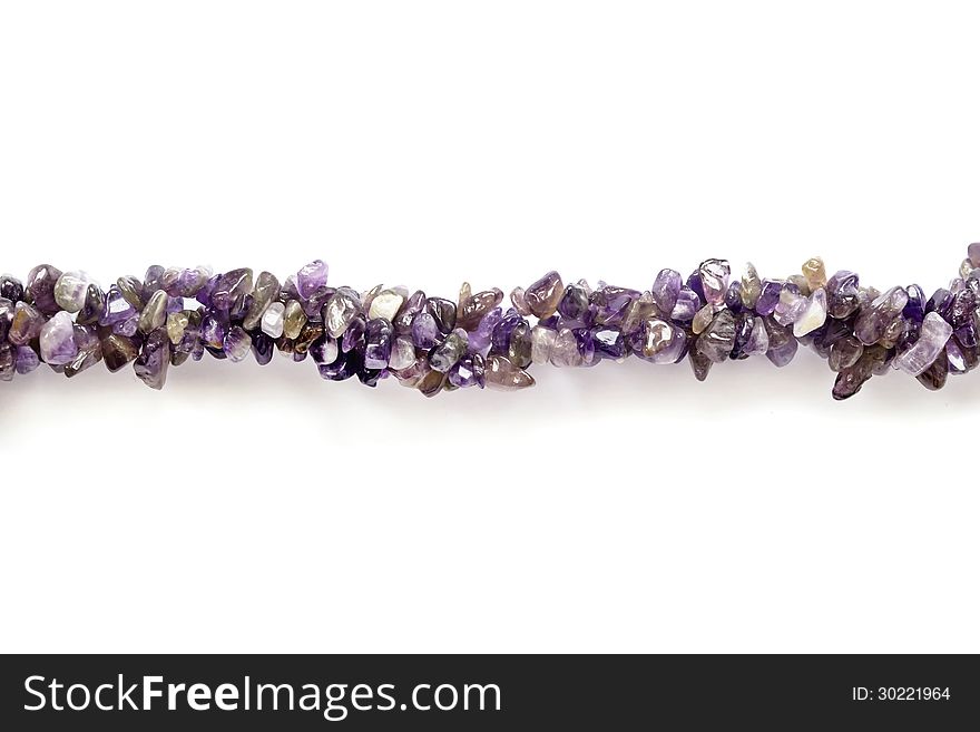 Thread of amethyst bead isolated over white