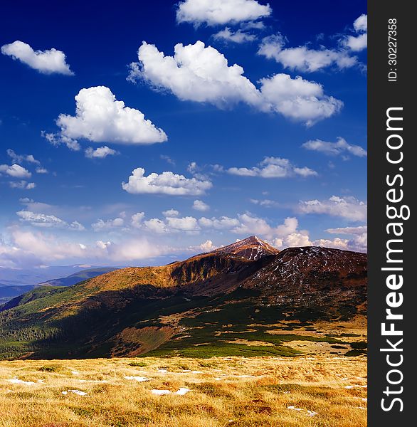 Spring landscape in the mountains with a beautiful clear day sky. Spring landscape in the mountains with a beautiful clear day sky