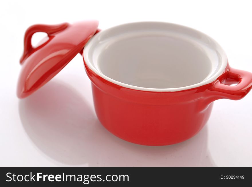 Ceramic, red pan on white background