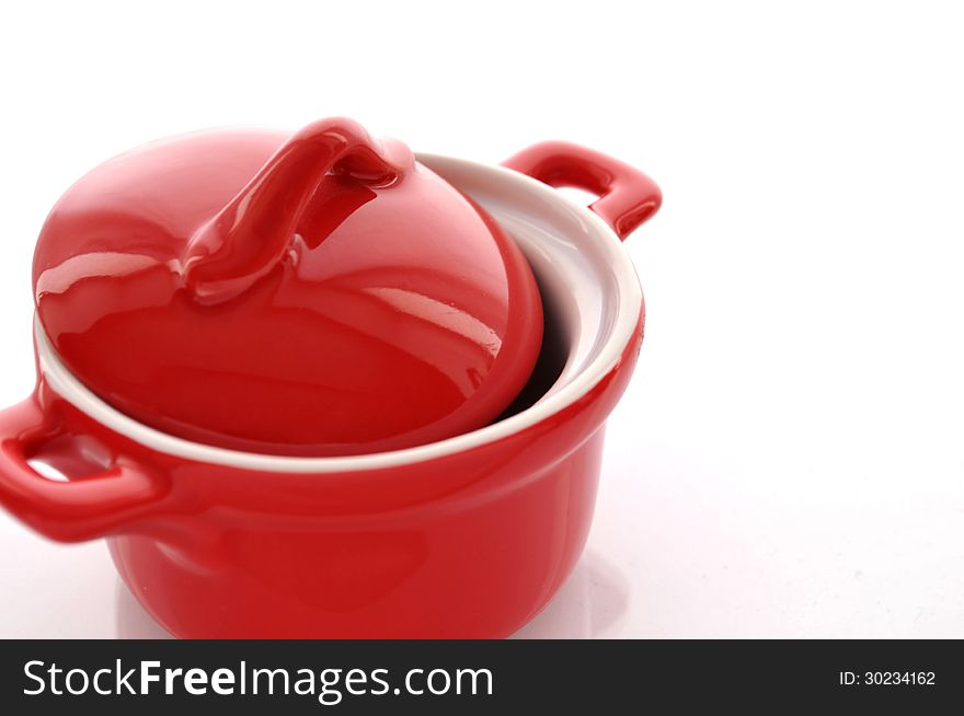 Red ceramic pan on white background. Red ceramic pan on white background