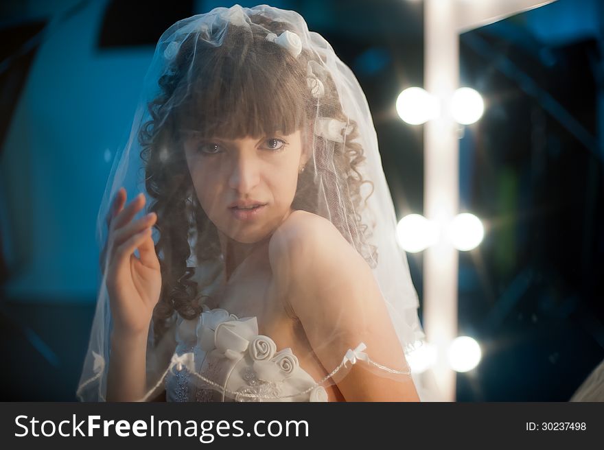 Photo portrait of a pretty girl bride in mirror image. Photo portrait of a pretty girl bride in mirror image