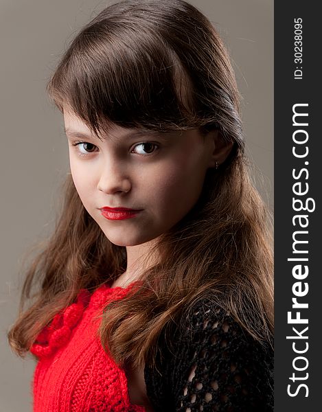 Portrait of young girl in a red dress. Portrait of young girl in a red dress