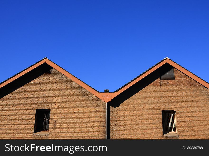 Brick Wall With Blue Sky.