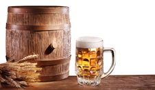 Beer Glasses With A Wooden Barrel. Royalty Free Stock Image
