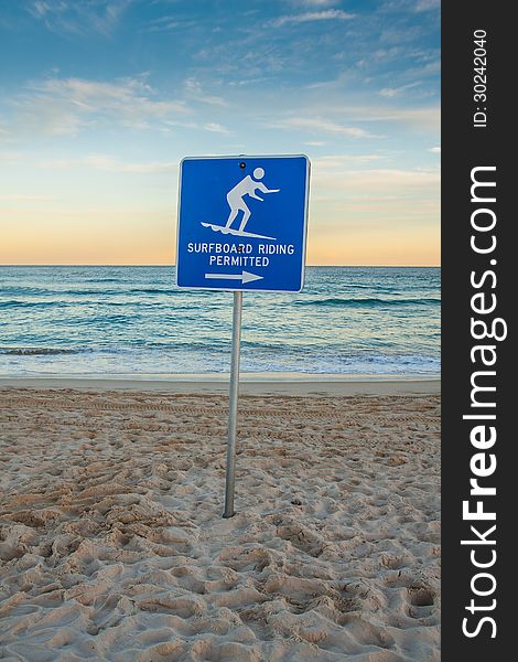 Sunset Beach With Surf Sign.