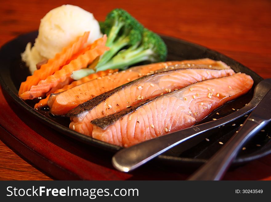 Atlantic salmon steak served with mash potato.