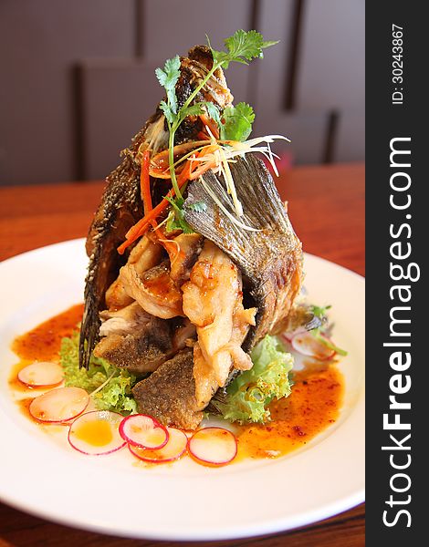 Thai special menu. Deep fried fish and served with sweet chilli sauce. Thai special menu. Deep fried fish and served with sweet chilli sauce.
