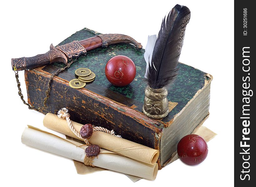 Composition with knife, manuscripts and red balls isolated. Composition with knife, manuscripts and red balls isolated