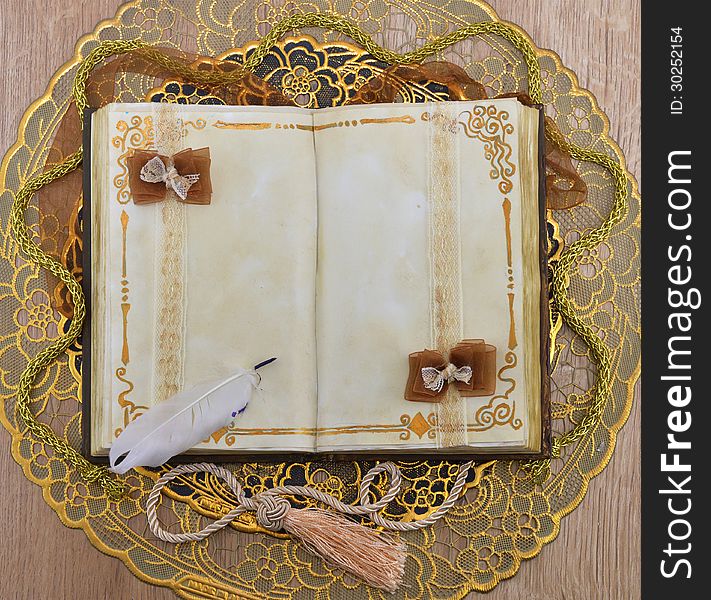 Open book with space for text on the golden napkin. Open book with space for text on the golden napkin